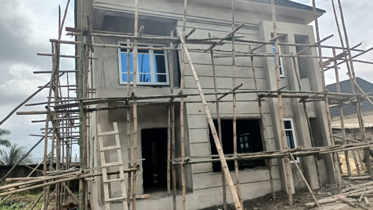 Duplex residence under construction, stucco stage with scaffolding